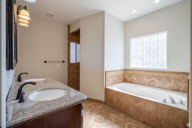 1986 Dove Dr, Santa Clara, UT 84765 - full bathroom featuring double vanity, a garden tub, visible vents, and a sink