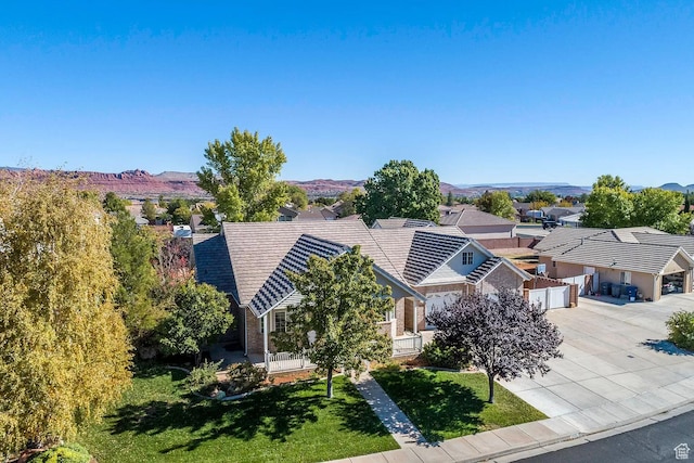 1986 Dove Dr, Santa Clara, UT 84765 - view of front of property with a front yard, concrete driveway, a mountain view, and a residential view