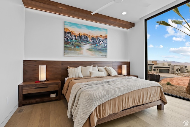 2031 E Pinnacle Dr, St George, UT 84790 - bedroom featuring recessed lighting, baseboards, floor to ceiling windows, and hardwood / wood-style floors