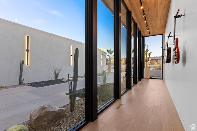 2031 E Pinnacle Dr, St George, UT 84790 - interior space with visible vents, wooden ceiling, wood finished floors, rail lighting, and expansive windows
