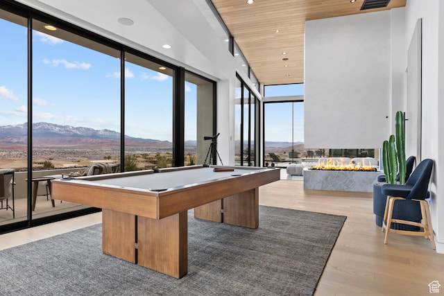 2031 E Pinnacle Dr, St George, UT 84790 - game room featuring wooden ceiling, wood finished floors, a healthy amount of sunlight, floor to ceiling windows, and a mountain view