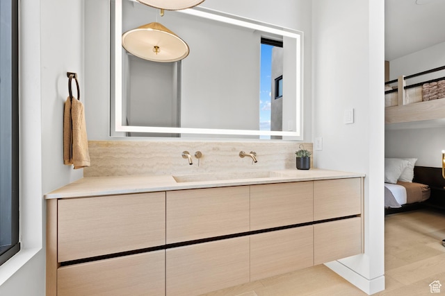2031 E Pinnacle Dr, St George, UT 84790 - bathroom with wood finished floors, vanity, and ensuite bathroom