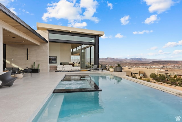 2031 E Pinnacle Dr, St George, UT 84790 - view of pool featuring a patio, a pool with connected hot tub, and a mountain view