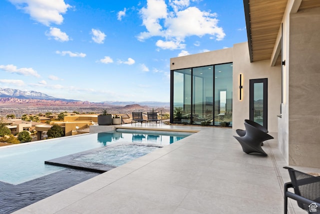 2031 E Pinnacle Dr, St George, UT 84790 - view of pool with an infinity pool, a patio area, and a mountain view