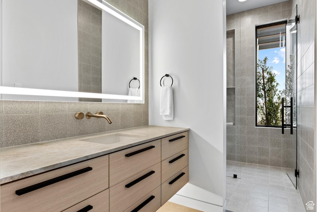2031 E Pinnacle Dr, St George, UT 84790 - full bath featuring a tile shower, backsplash, a wealth of natural light, and vanity