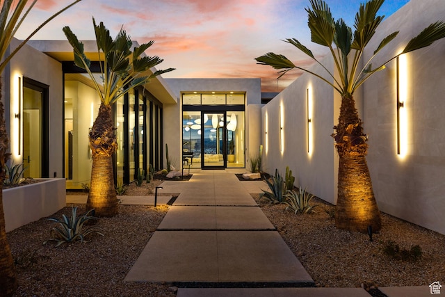 2031 E Pinnacle Dr, St George, UT 84790 - exterior entry at dusk featuring stucco siding