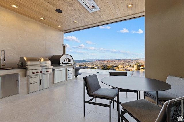 2031 E Pinnacle Dr, St George, UT 84790 - view of patio featuring exterior kitchen, outdoor dining area, a sink, and grilling area