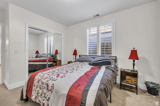 6067 S 3950 W, Roy, UT 84067 - carpeted bedroom featuring a closet, visible vents, and baseboards