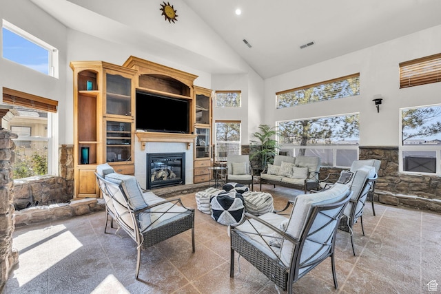6067 S 3950 W, Roy, UT 84067 - living area featuring high vaulted ceiling, a glass covered fireplace, and visible vents