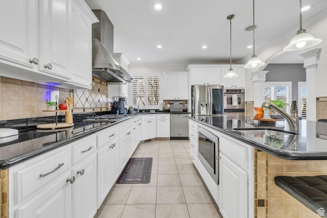 6067 S 3950 W, Roy, UT 84067 - kitchen with light tile patterned floors, wall chimney exhaust hood, appliances with stainless steel finishes, and a sink