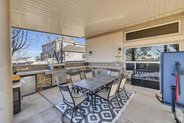6067 S 3950 W, Roy, UT 84067 - view of patio featuring exterior kitchen, outdoor dining area, and grilling area