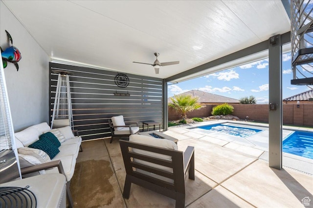 view of patio featuring outdoor lounge area, a fenced backyard, ceiling fan, and a fenced in pool