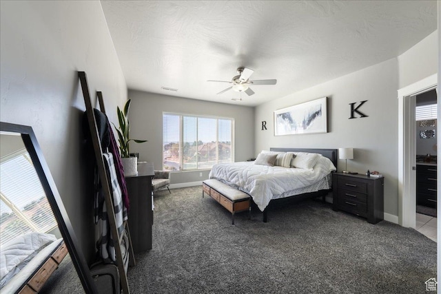 bedroom featuring baseboards, visible vents, and carpet flooring