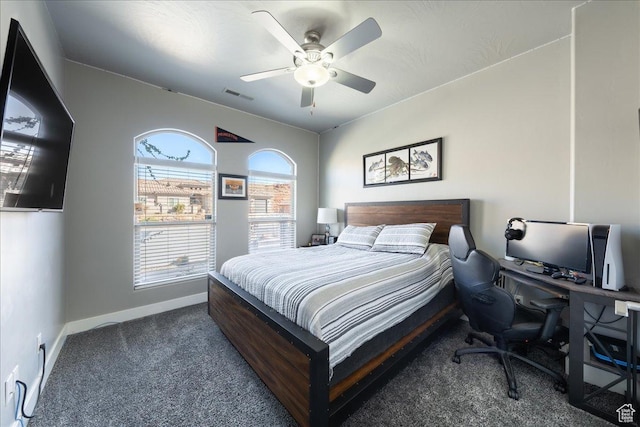 carpeted bedroom with a ceiling fan, visible vents, and baseboards