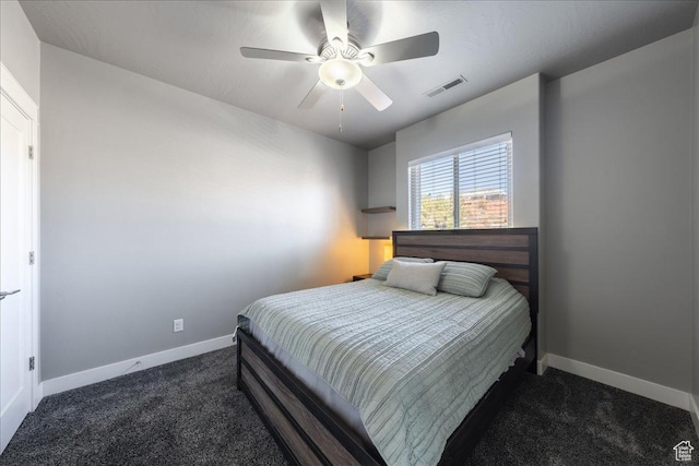 carpeted bedroom with a ceiling fan, visible vents, and baseboards