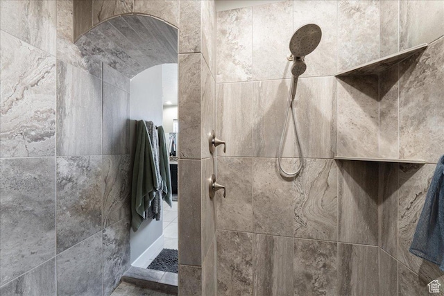 bathroom with tiled shower