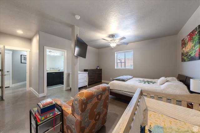 bedroom with finished concrete floors, a textured ceiling, and baseboards