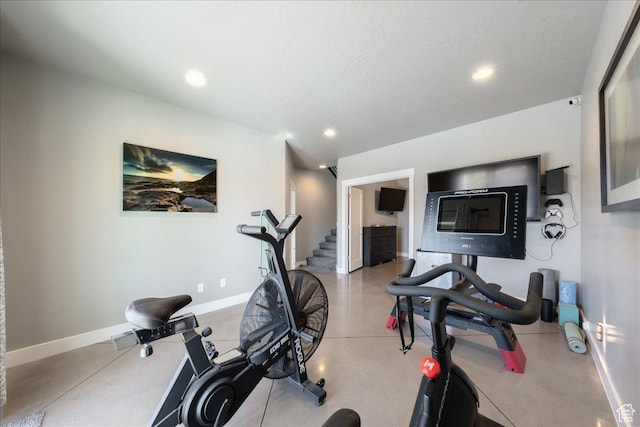 exercise room featuring baseboards and recessed lighting