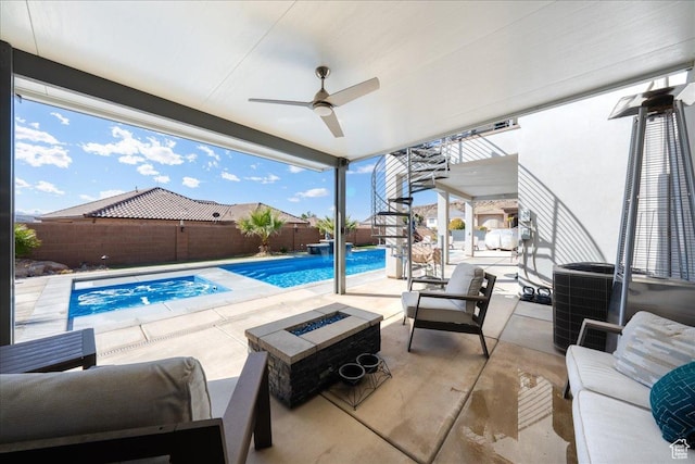 view of patio featuring a fenced in pool, an outdoor living space with a fire pit, a ceiling fan, central AC, and a fenced backyard