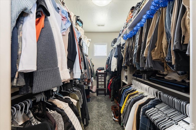 walk in closet with carpet floors and visible vents