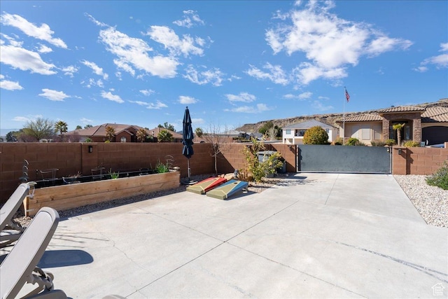 view of patio / terrace with fence private yard and a gate