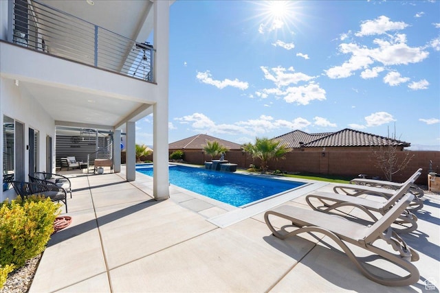 view of swimming pool with a patio area, a fenced backyard, and a fenced in pool