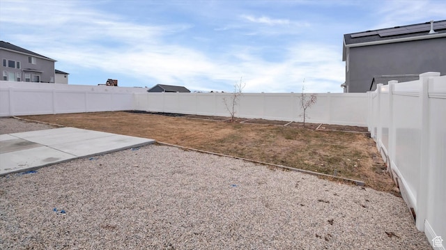 view of yard featuring a patio and a fenced backyard