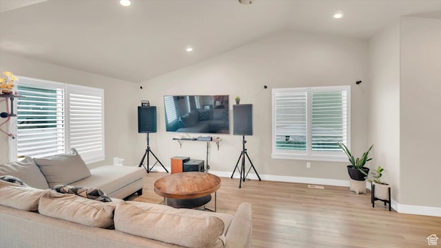 living room featuring vaulted ceiling, recessed lighting, wood finished floors, and baseboards