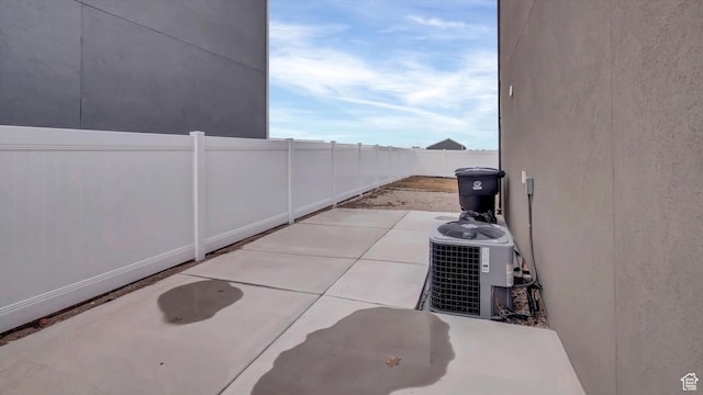 view of patio / terrace featuring a fenced backyard and central AC unit