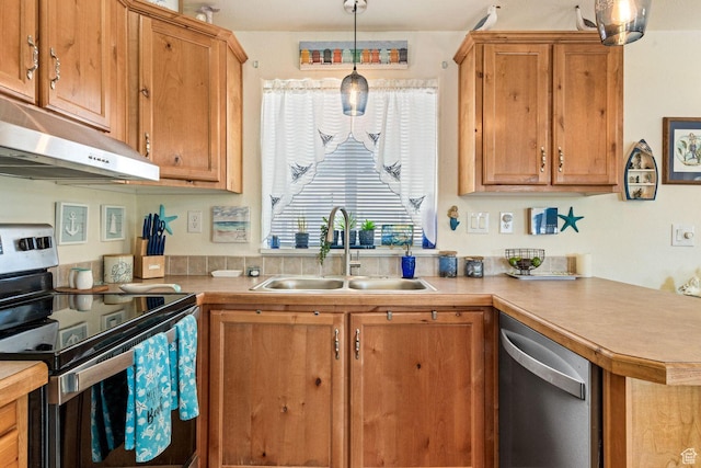 1160 E Telegraph St Unit 220, Washington, UT 84780 - kitchen with stainless steel appliances, a sink, under cabinet range hood, light countertops, and brown cabinets