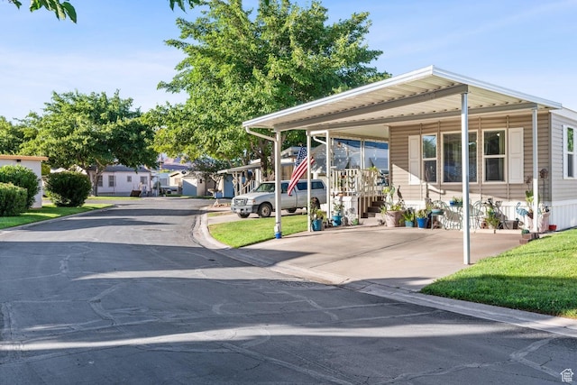 1160 E Telegraph St Unit 220, Washington, UT 84780 - view of front of house featuring stairway and a carport