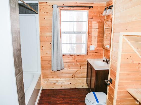1290 Echo Crk Unit 2, Echo, UT 84024 - bathroom with toilet, wood walls, vanity, wood finished floors, and a bath