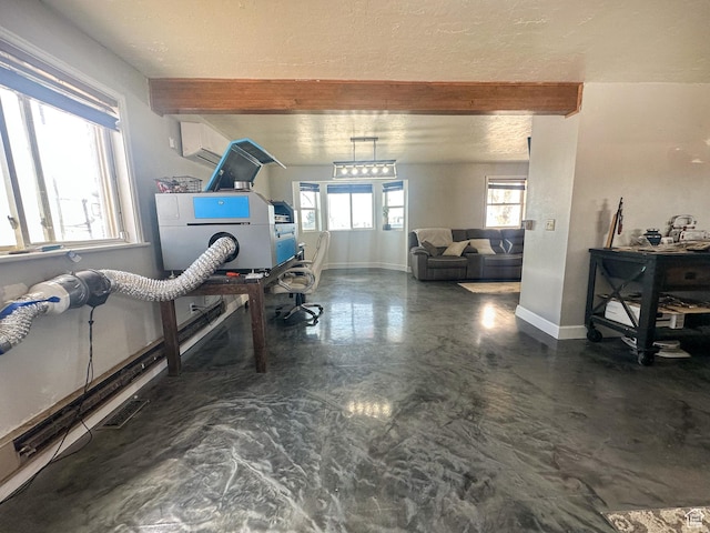interior space featuring a textured ceiling, baseboards, finished concrete floors, beamed ceiling, and visible vents