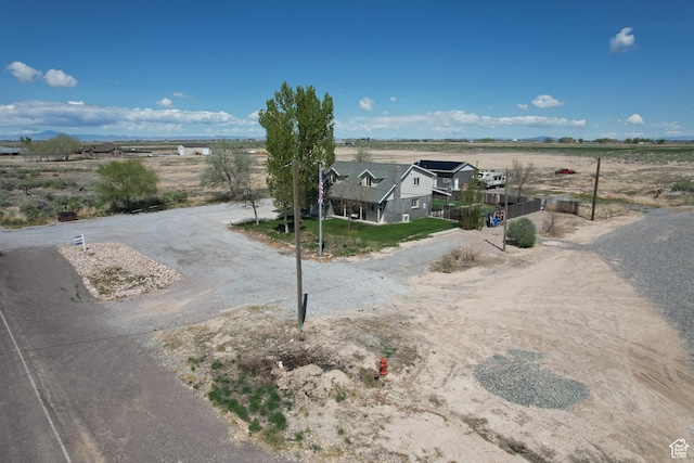 birds eye view of property with a rural view