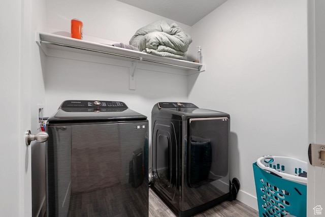 4758 E Hidden Loop Rd, Eagle Mountain, UT 84005 - laundry area with laundry area, washing machine and dryer, baseboards, and wood finished floors