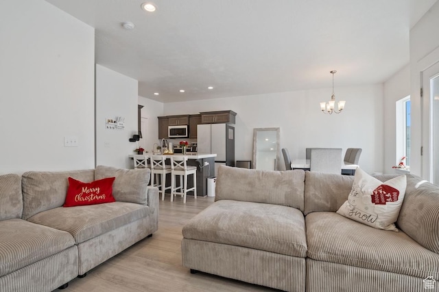 4758 E Hidden Loop Rd, Eagle Mountain, UT 84005 - living area featuring light wood-style floors, recessed lighting, and a chandelier