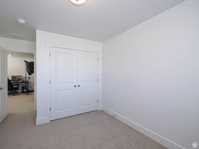 3361 W 3275 N, Plain City, UT 84404 - unfurnished bedroom with baseboards, a closet, and light colored carpet