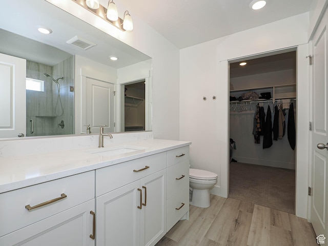 3361 W 3275 N, Plain City, UT 84404 - full bath with toilet, wood finished floors, vanity, visible vents, and a shower stall