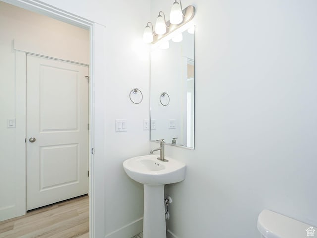 3361 W 3275 N, Plain City, UT 84404 - bathroom with baseboards, toilet, and wood finished floors