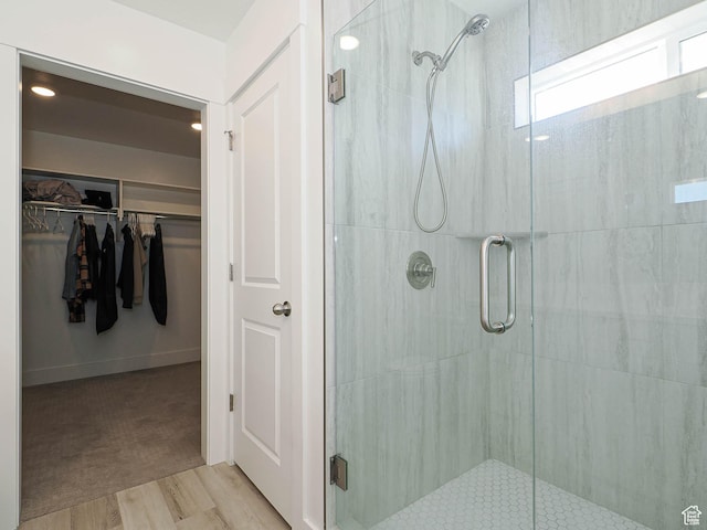 3361 W 3275 N, Plain City, UT 84404 - bathroom with a walk in closet, a shower stall, and wood finished floors