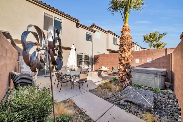 506 N Sol Grande Ln, Washington, UT 84780 - view of patio / terrace featuring a hot tub, a fenced backyard, and outdoor dining space