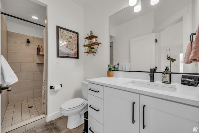 506 N Sol Grande Ln, Washington, UT 84780 - bathroom with a stall shower, baseboards, vanity, and toilet