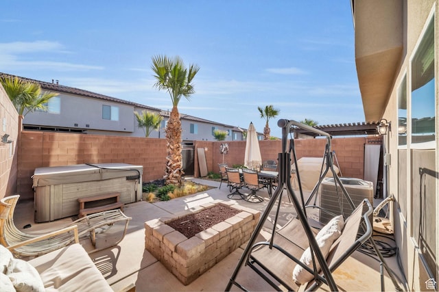 506 N Sol Grande Ln, Washington, UT 84780 - view of patio / terrace with a hot tub, a fire pit, outdoor dining area, and a fenced backyard