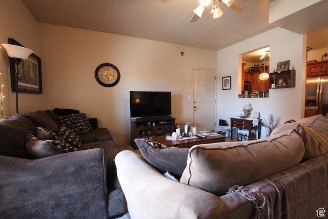 living area featuring a ceiling fan