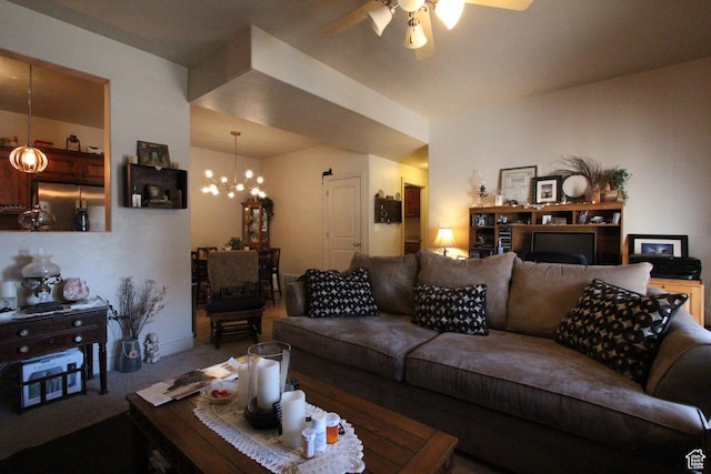 carpeted living area featuring ceiling fan with notable chandelier