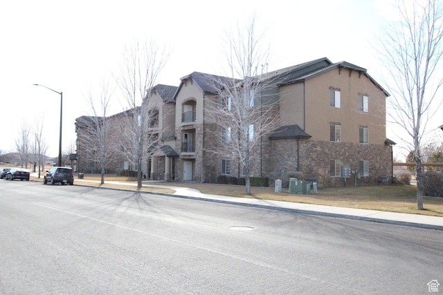 view of building exterior with cooling unit