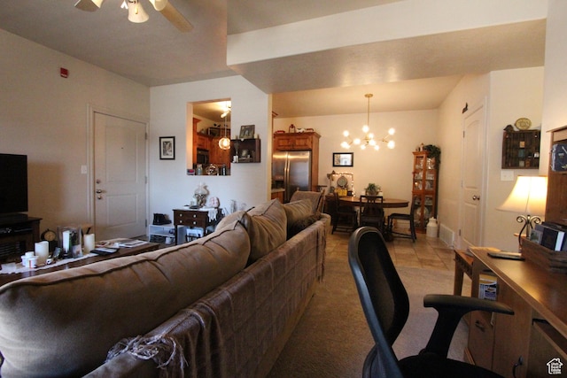 living room featuring ceiling fan with notable chandelier and light colored carpet