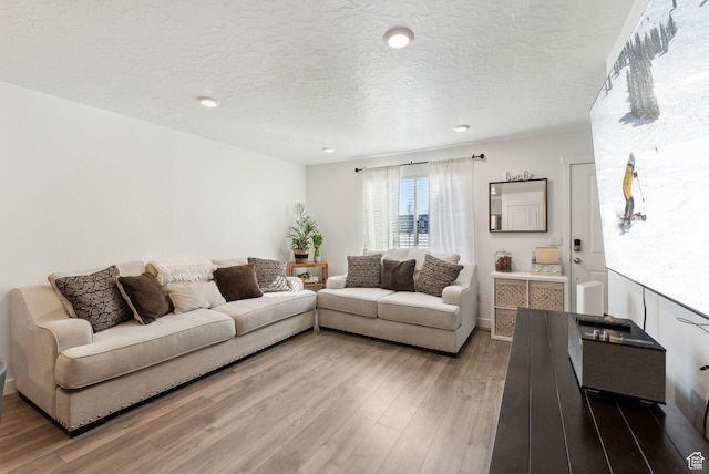 1099 E Quarterdeck Way, Saratoga Springs, UT 84045 - living room featuring recessed lighting, a textured ceiling, and light wood finished floors
