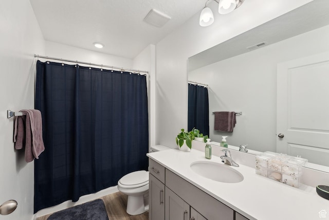 1099 E Quarterdeck Way, Saratoga Springs, UT 84045 - full bathroom featuring wood finished floors, a shower with shower curtain, toilet, vanity, and visible vents