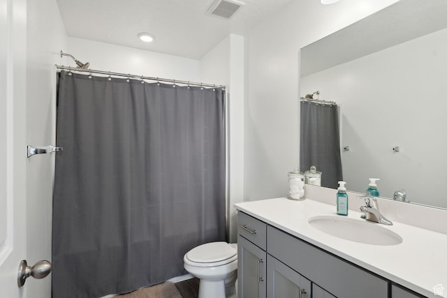 1099 E Quarterdeck Way, Saratoga Springs, UT 84045 - bathroom featuring toilet, visible vents, vanity, and a shower with shower curtain